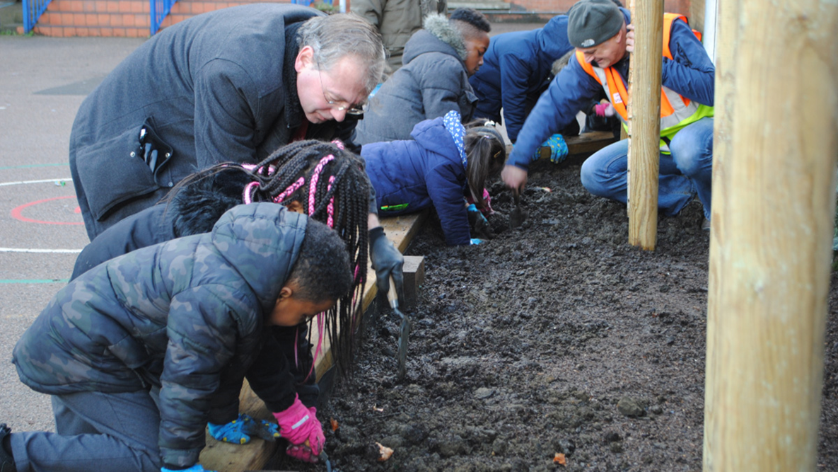 Pupils planting at Ilderton School